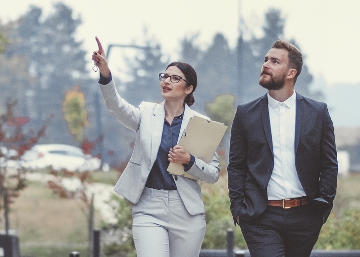 Real estate agent with client